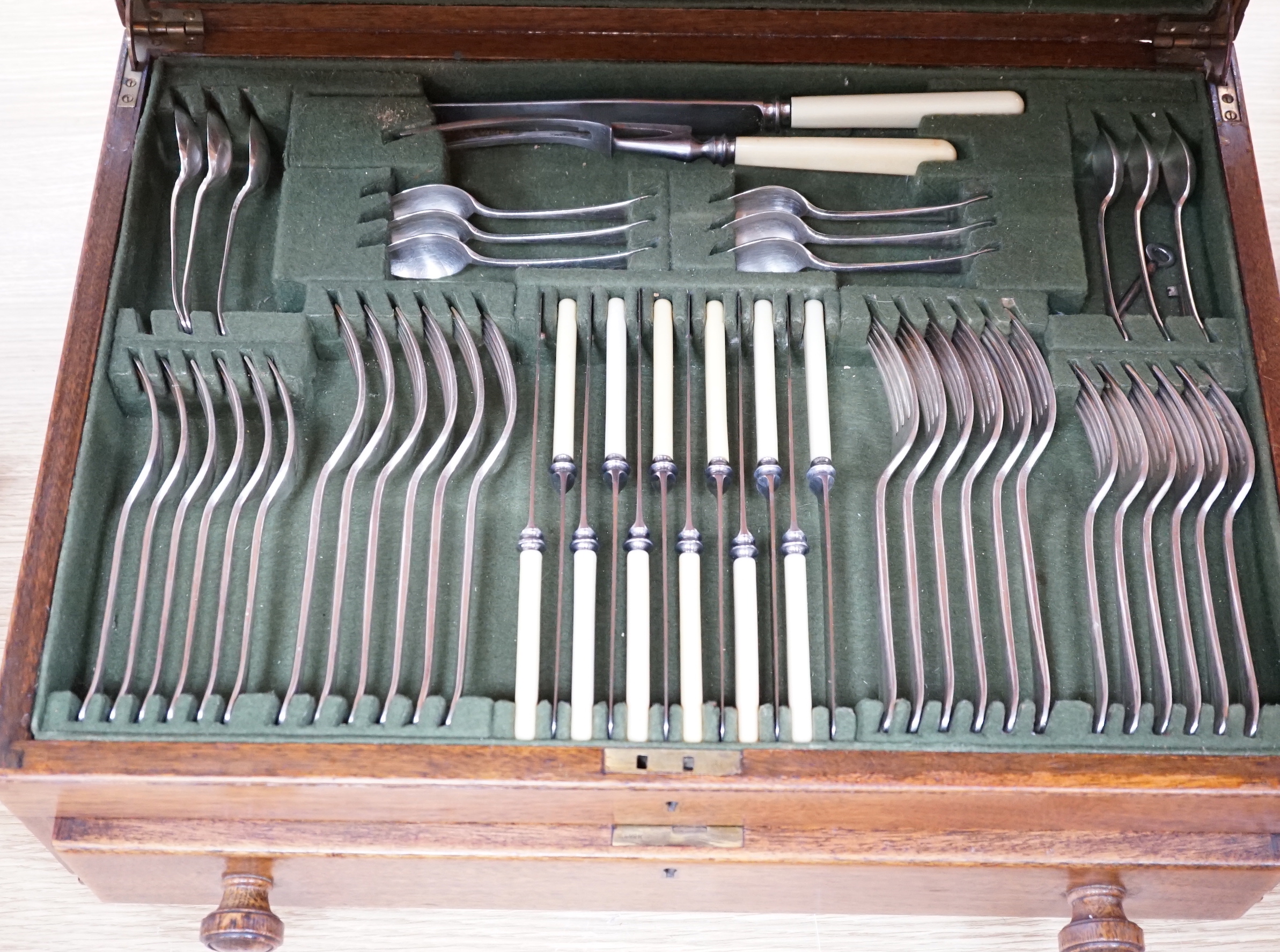An oak cased canteen of silver plated flatware, 51cm wide